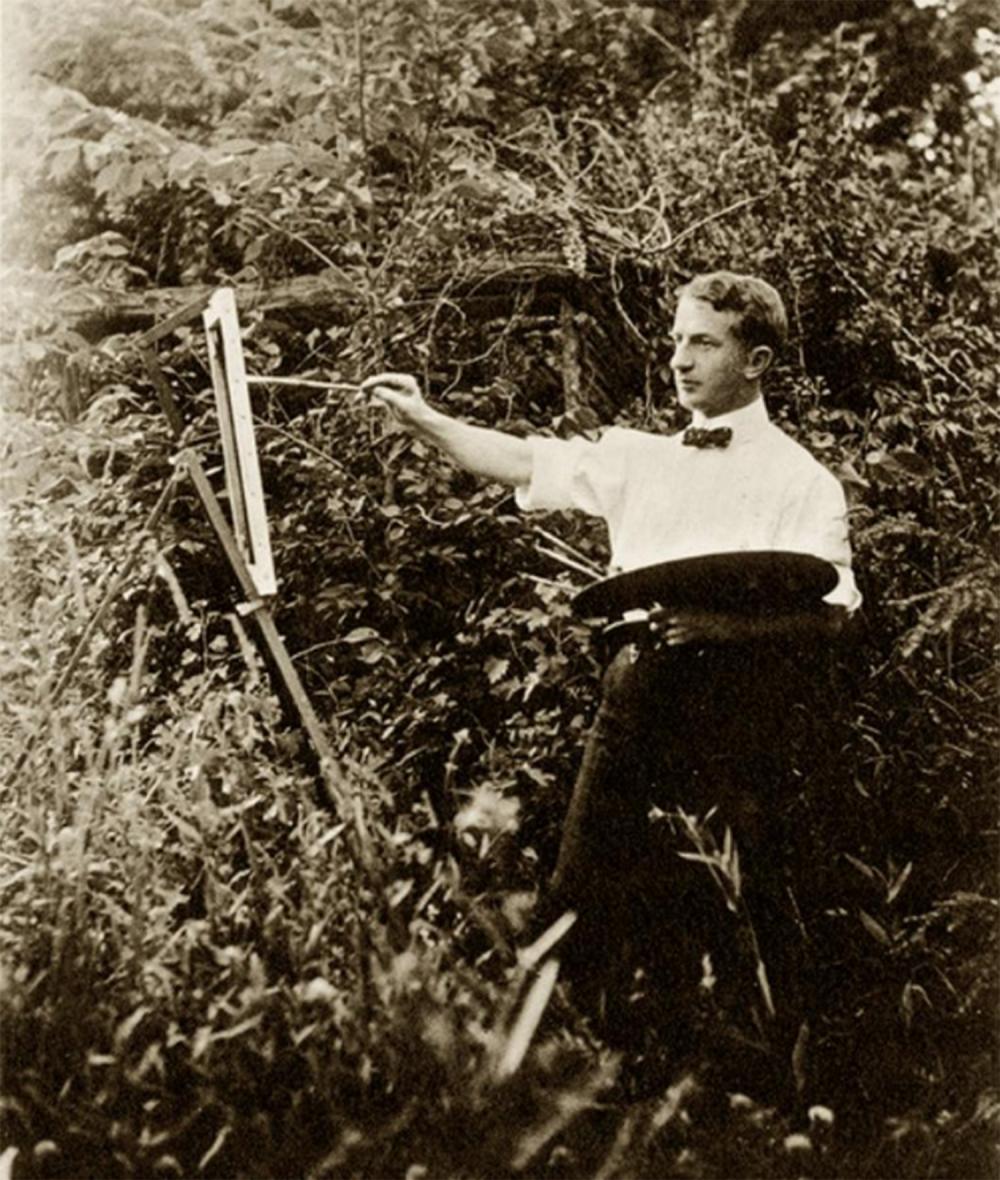 Artist Arthur Heming paints while standing in a forested area near the border of the Florence Griswold property. Courtesy of the Florence Griswold Museum