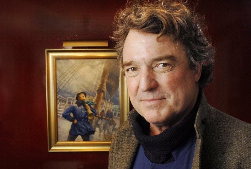 Artist Jamie Wyeth in front of painting by father N.C. Wyeth, Image Courtesy Portland Press Herald 