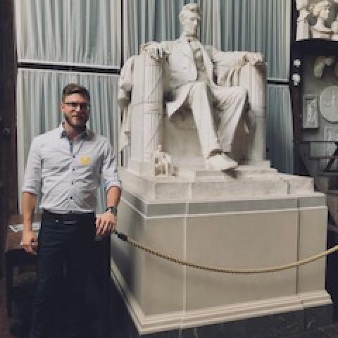 Dorian Sanders next to carving of Lincoln by Daniel Chester French 2018