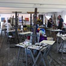 The main studio at The Art Barge with a painting class in session